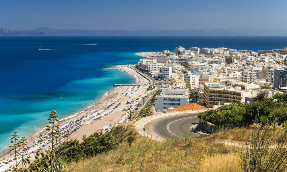 aerial view of city buildings near sea during daytime