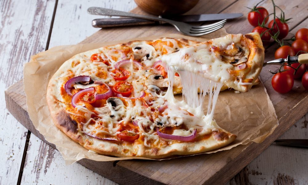 pizza on brown wooden tray